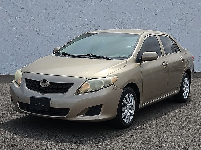 2010 Toyota Corolla Base in Gold — front three-quarter view